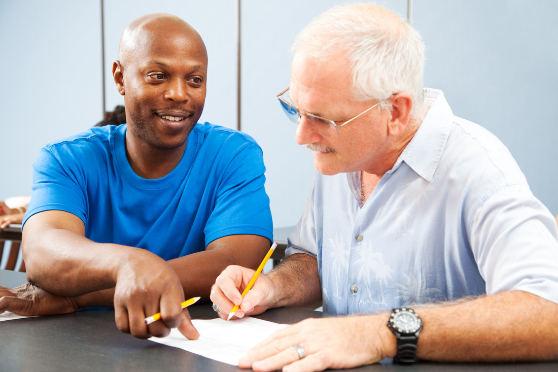 African-American man coaching an Adult Learner